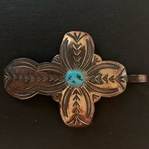 Silver cross pendant with blue stone